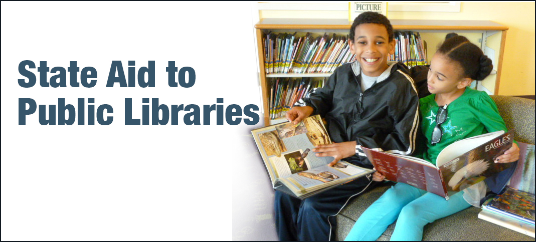 two children looking at books in a library 